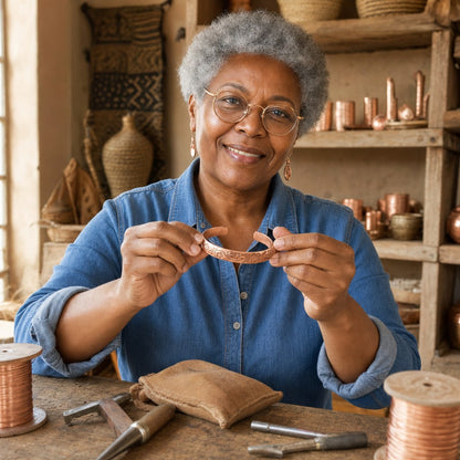Our founder holding the Bloom Copper Bracelet in her workshop