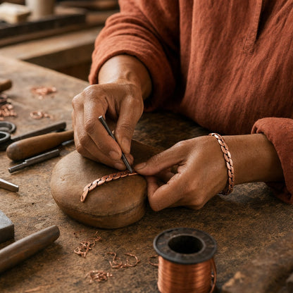 Our founder finishing the Marsh Copper Anklet by hand